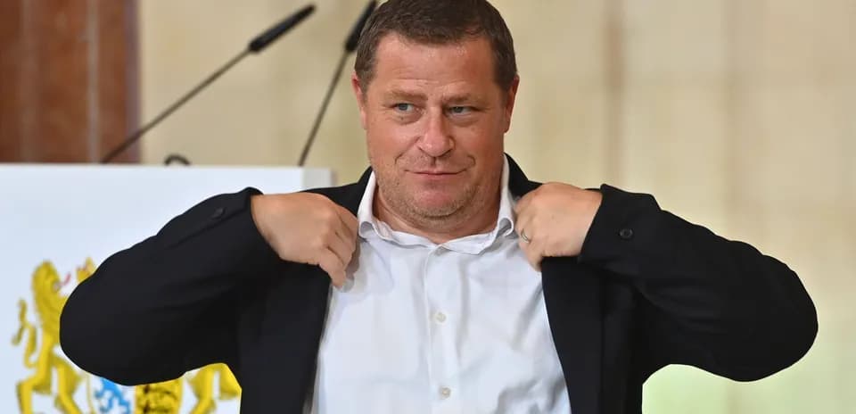 Person adjusting jacket at a podium