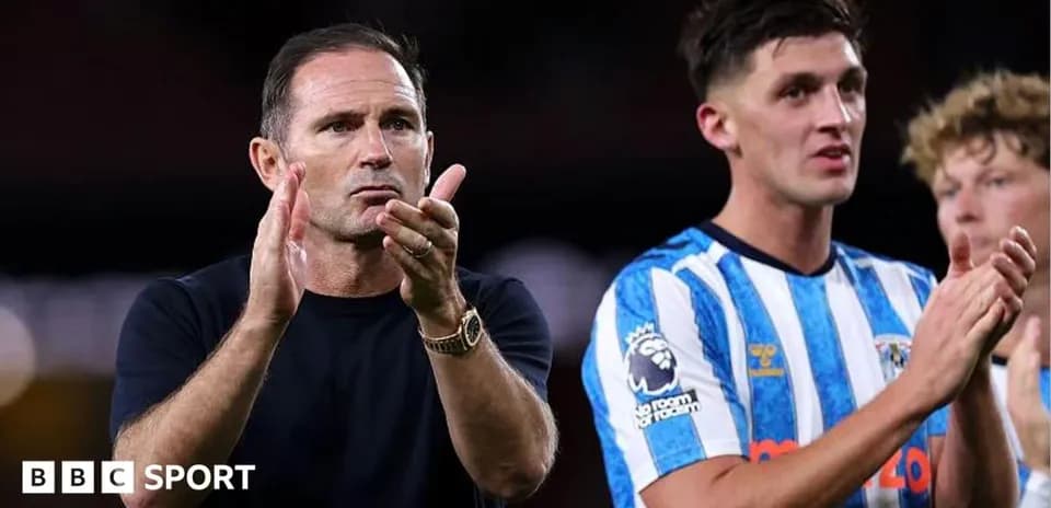 Manager and player applauding after the match
