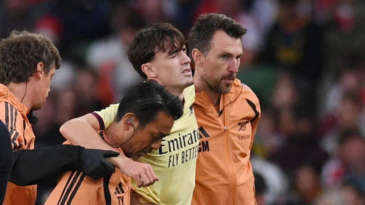 Player receiving assistance from staff on the field