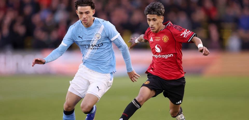 Manchester City and Manchester United players in action