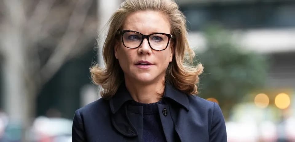 Woman with glasses outdoors in urban setting