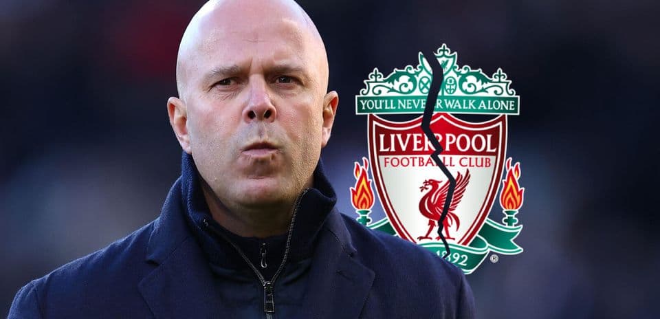 Men's football coach in front of Liverpool logo