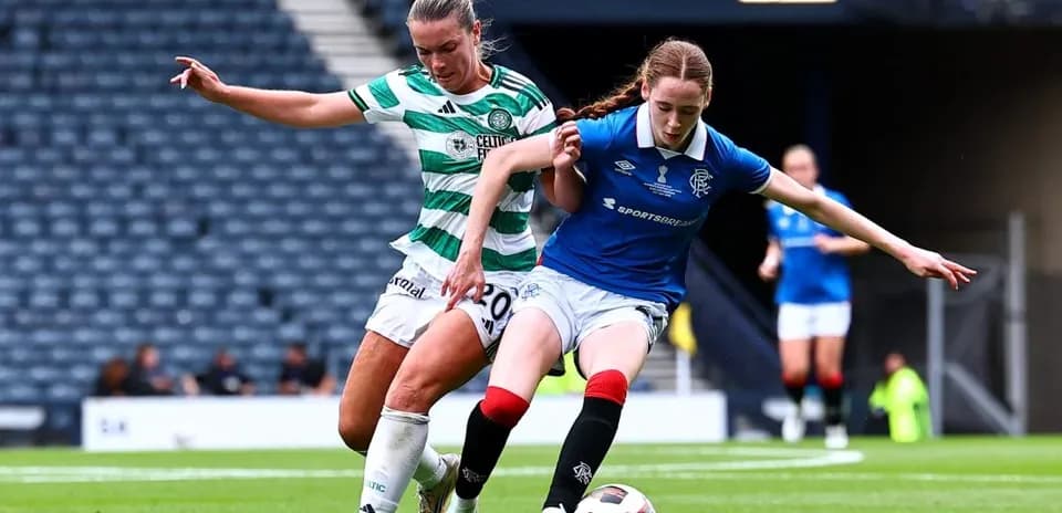 Celtic and Rangers players contesting possession of the ball