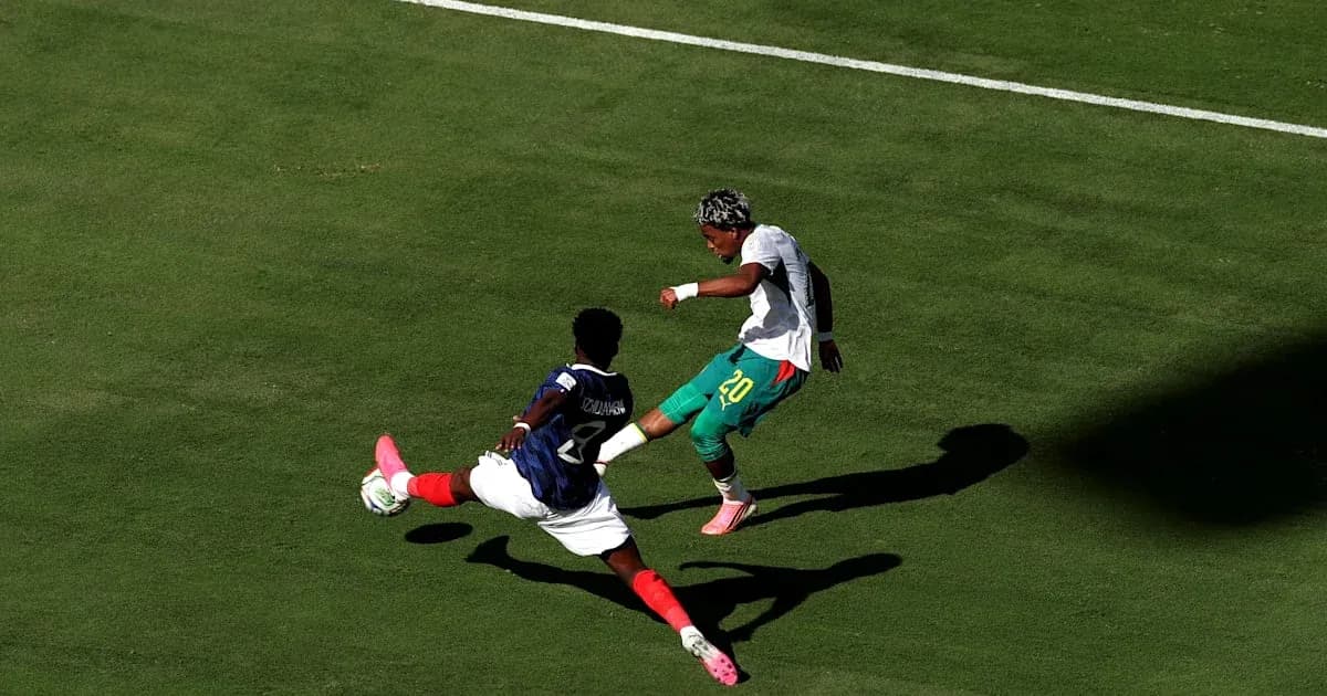 Player tackling opponent during a soccer match