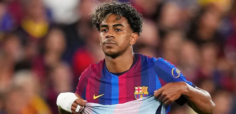 Barcelona player adjusting his jersey during match