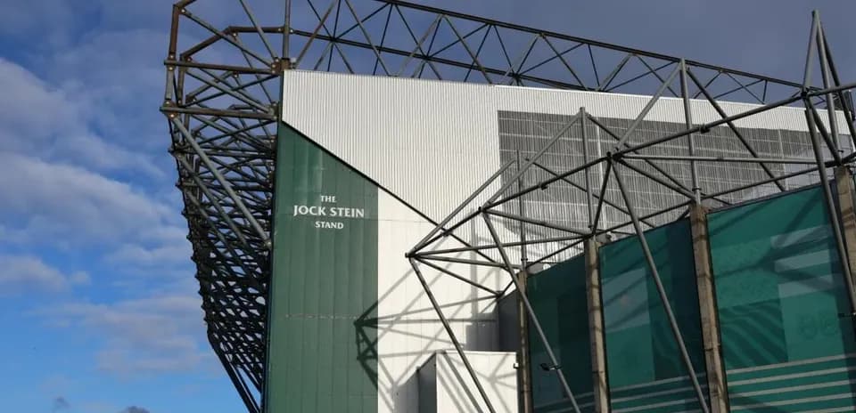 Jock Stein Stand of a stadium under cloudy sky