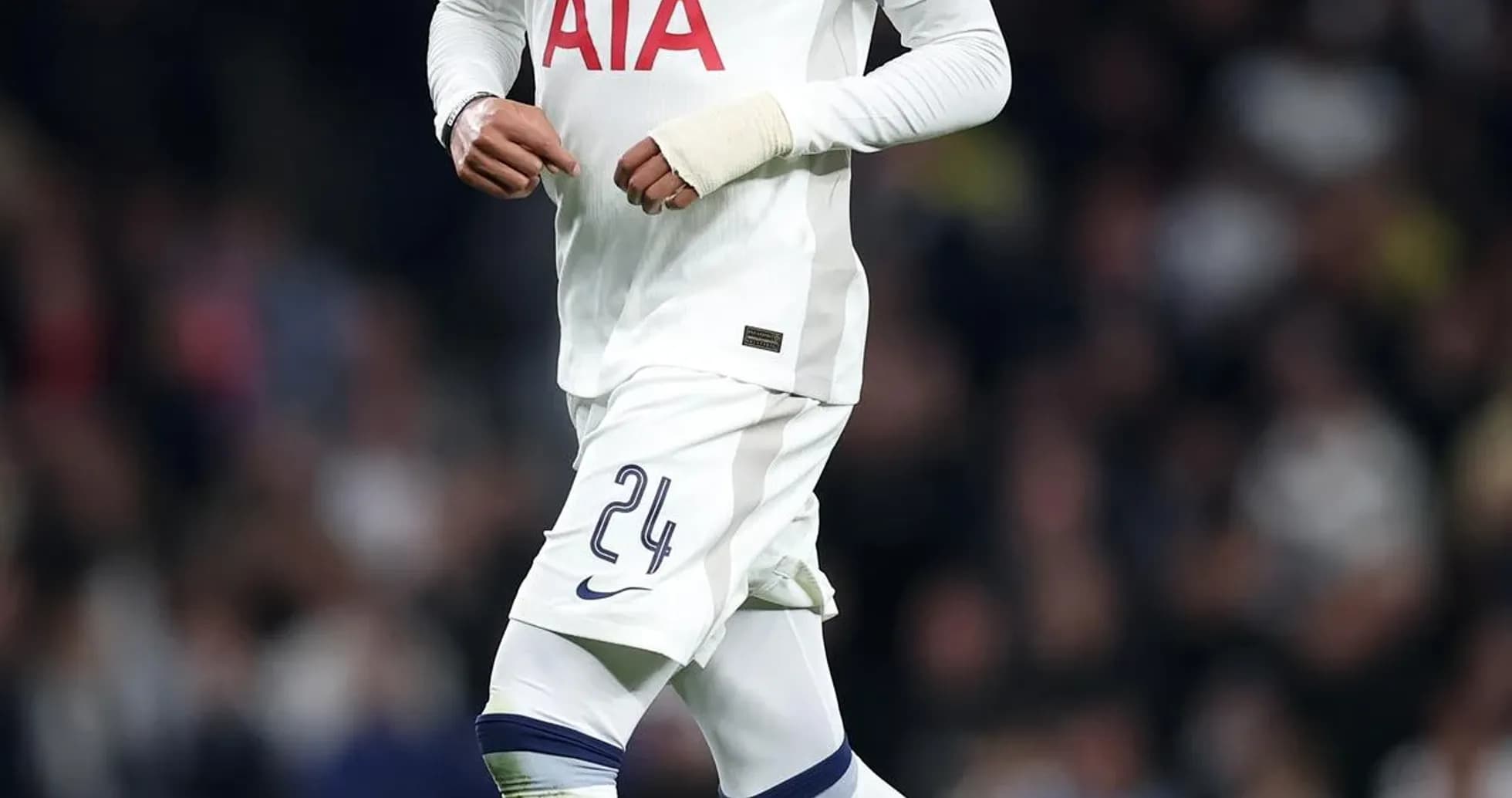 Tottenham player running with the ball during match