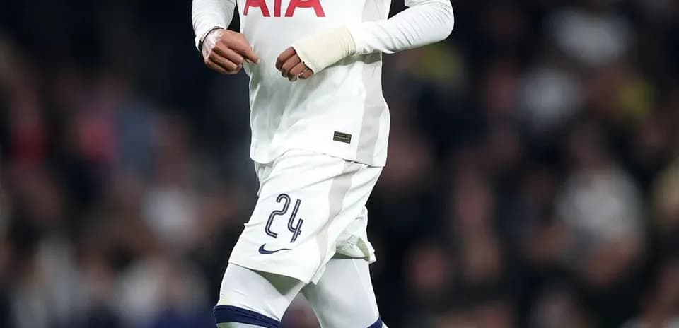 Tottenham player running with the ball during match