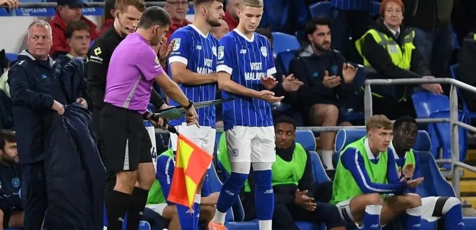 Player preparing to substitute during football match
