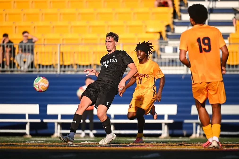 Player kicking ball during soccer match action