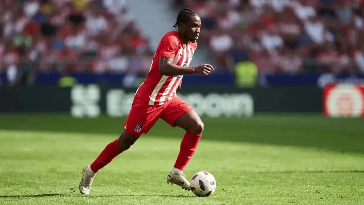 Atletico Madrid player running with the ball