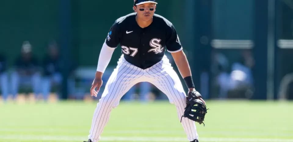 Baseball player in defensive stance on field