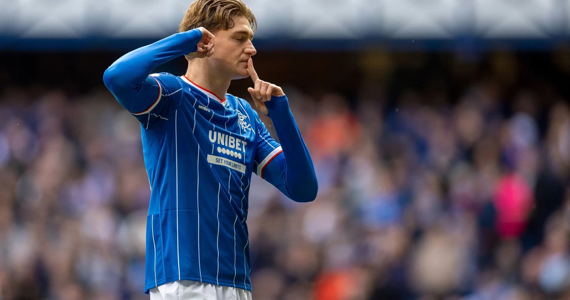 Rangers player shushing crowd after scoring goal