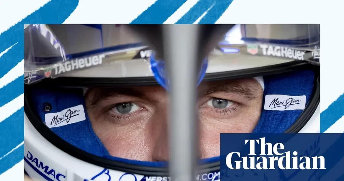 Close-up of a driver wearing a racing helmet