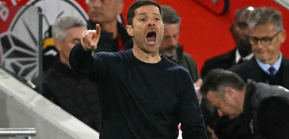 Coach gesturing and speaking during a match