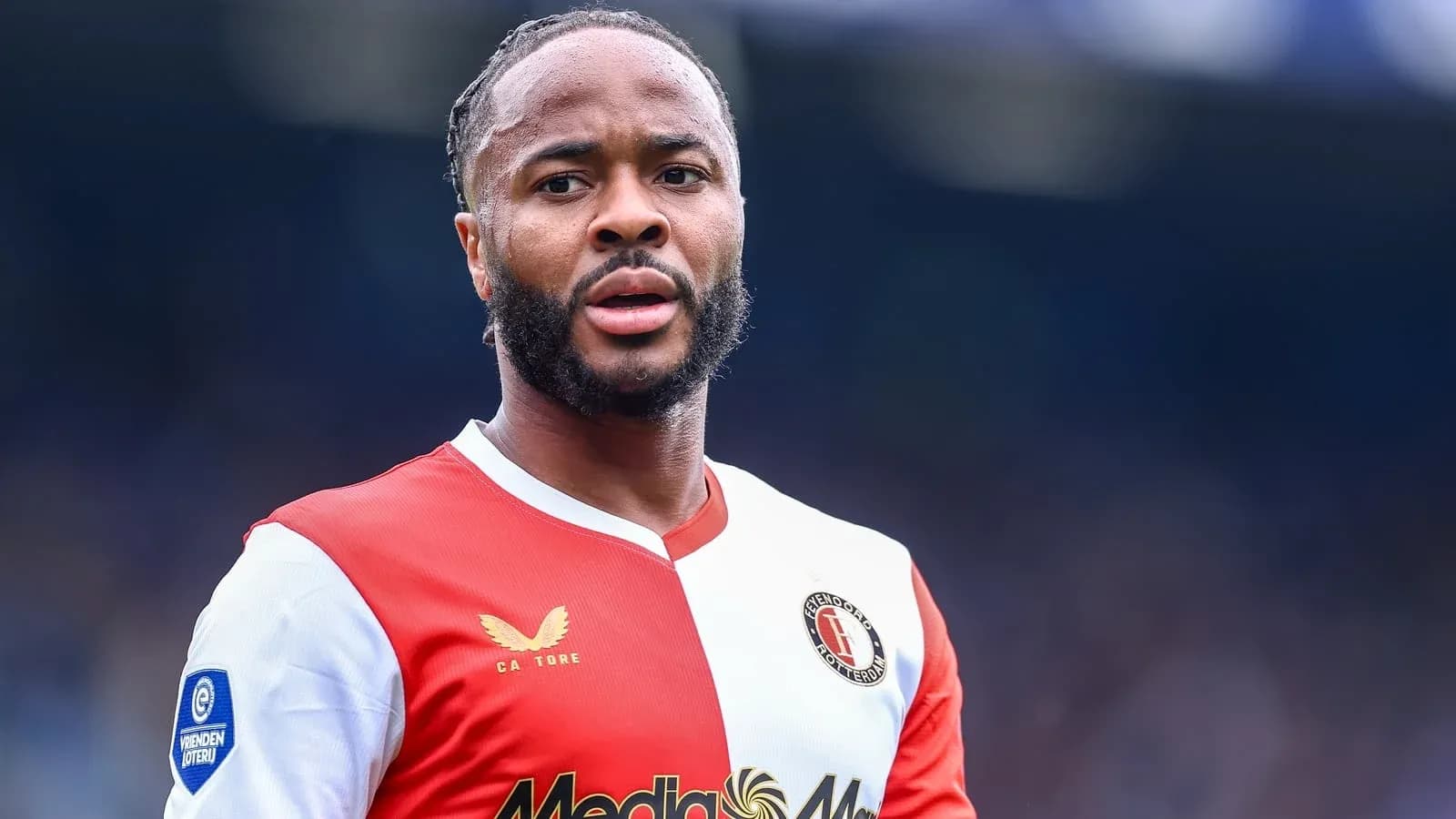 Feyenoord player in red and white jersey during match