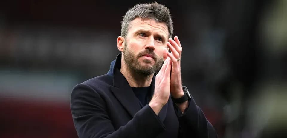 Football manager applauding fans after match