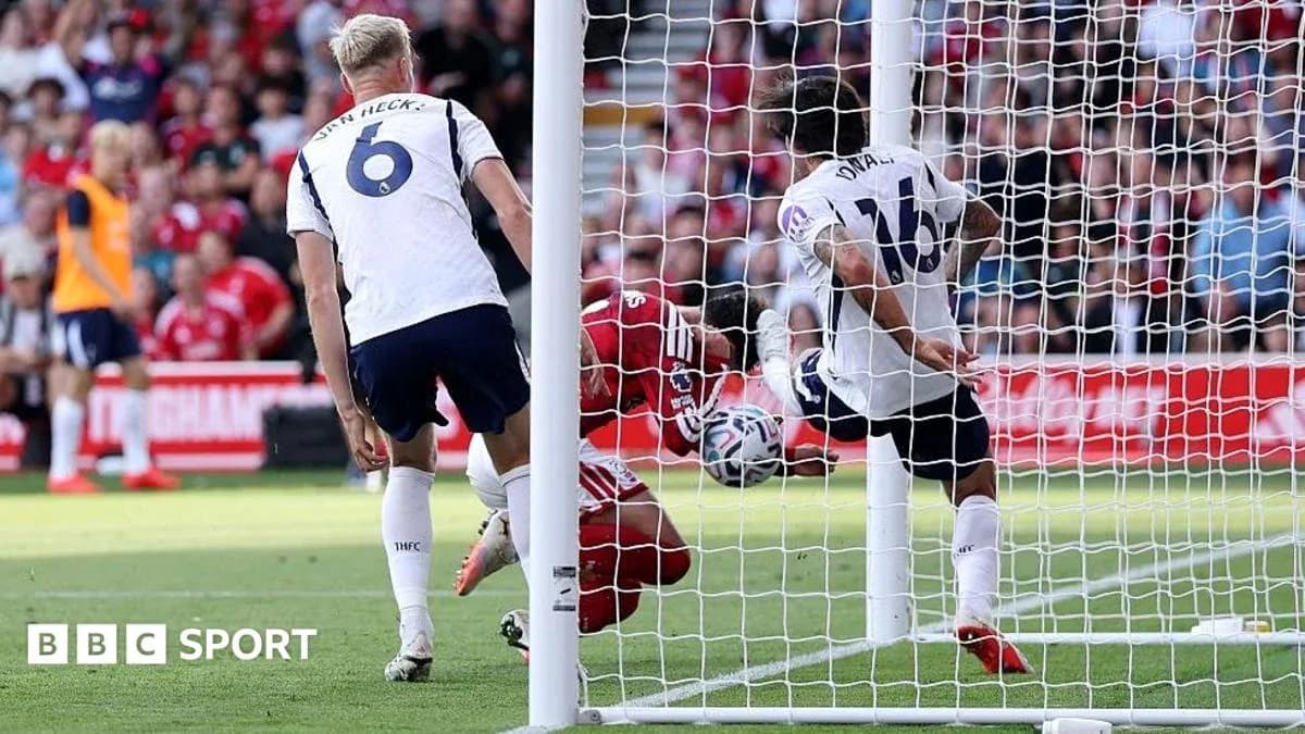 Goalkeeper making a save near goal line