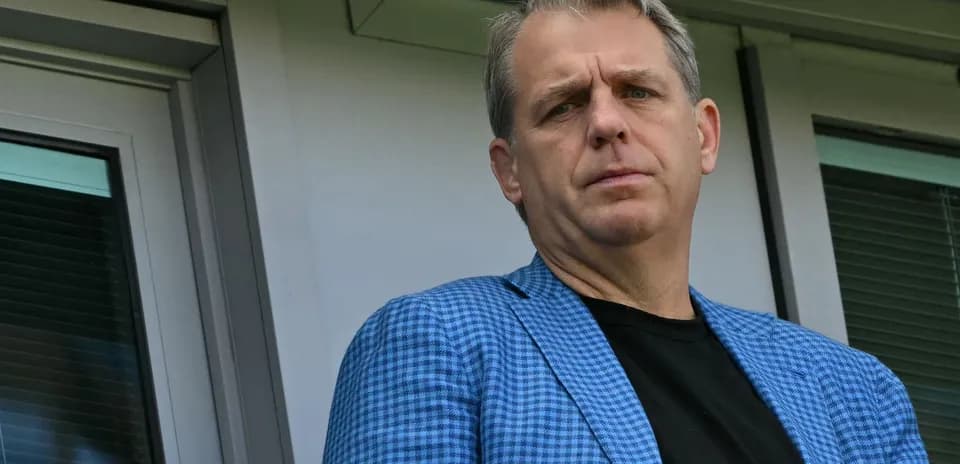 Person in a blue blazer looking towards the camera