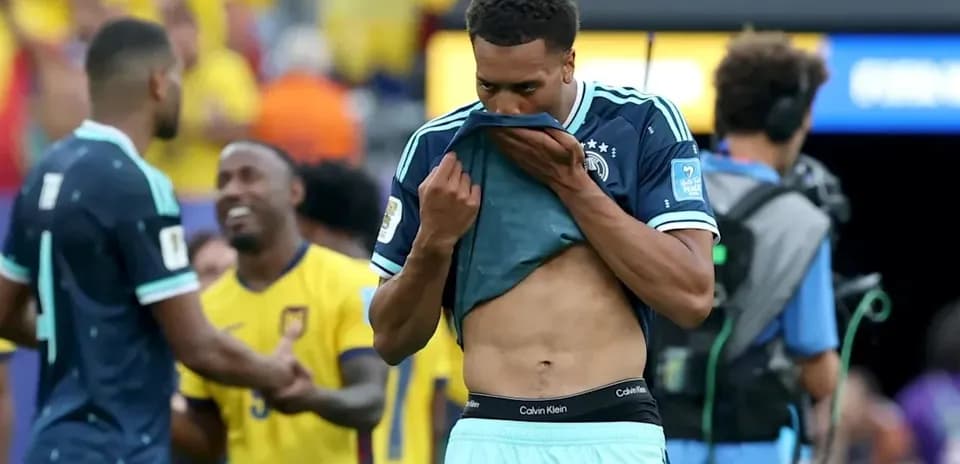 Player removing shirt after match with spectators