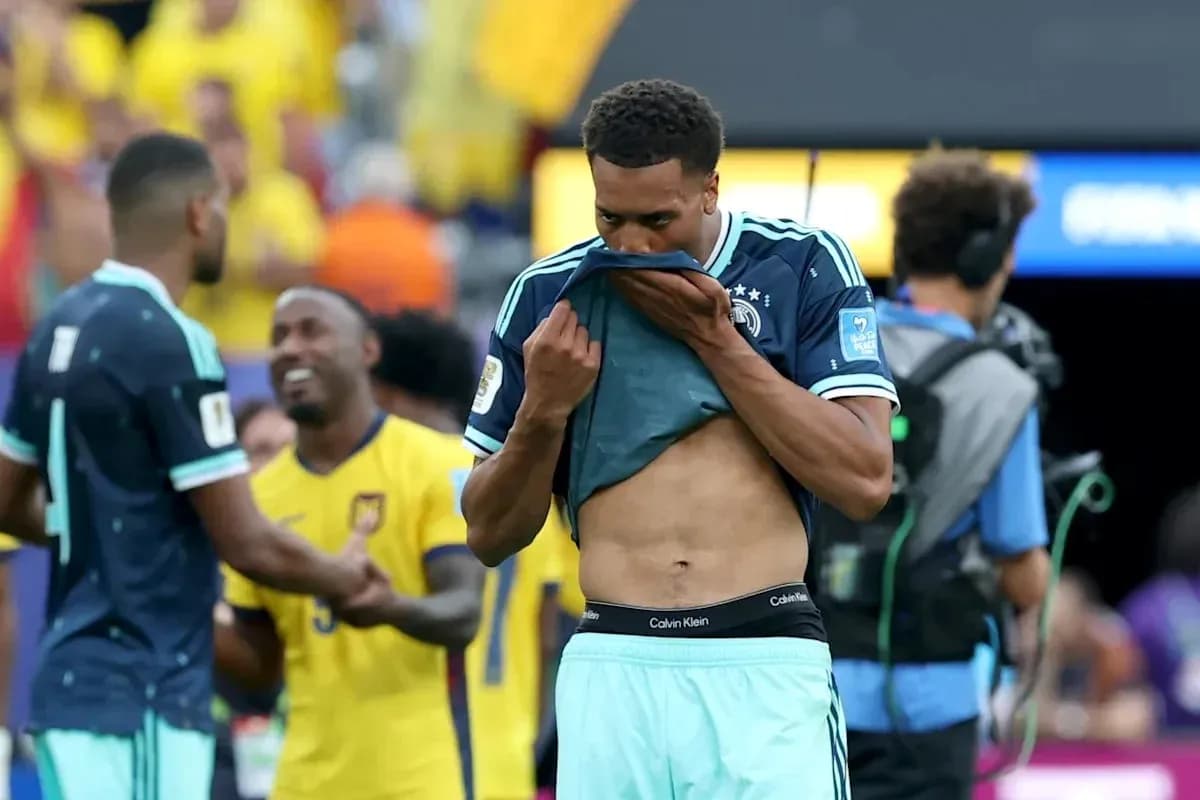 Player removing shirt after match with spectators