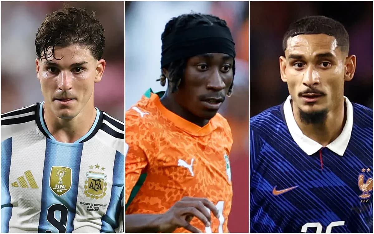 Three football players in national team jerseys