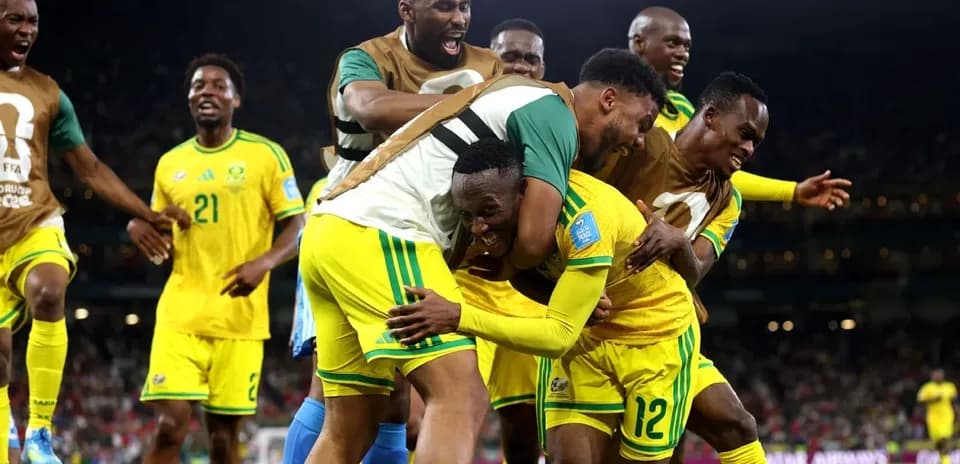 South African players celebrating a goal on the field