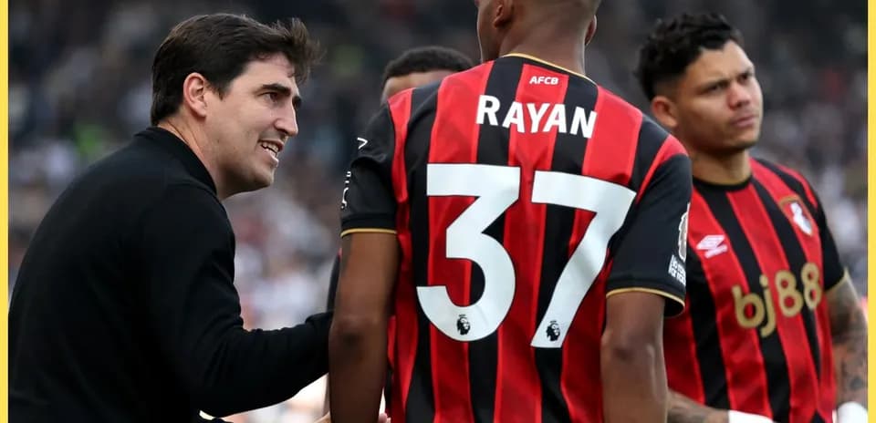 Bournemouth coach discussing strategy with players