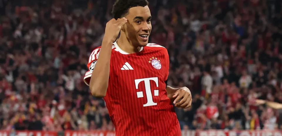 Bayern Munich player celebrating goal in stadium