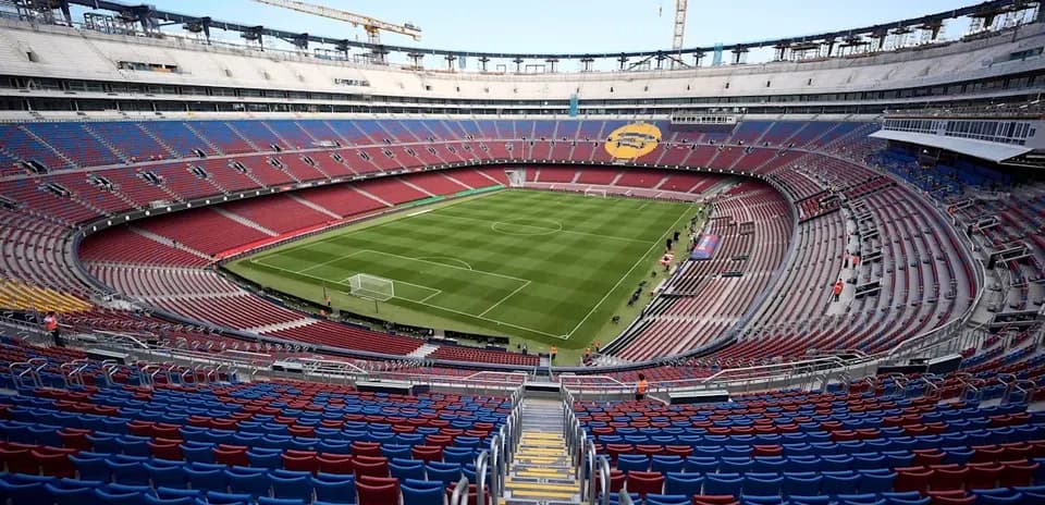 Camp Nou stadium with empty seats and pitch