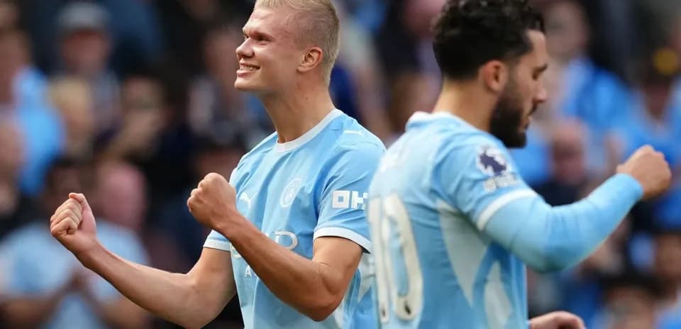 Erling Haaland celebrating a goal with teammates