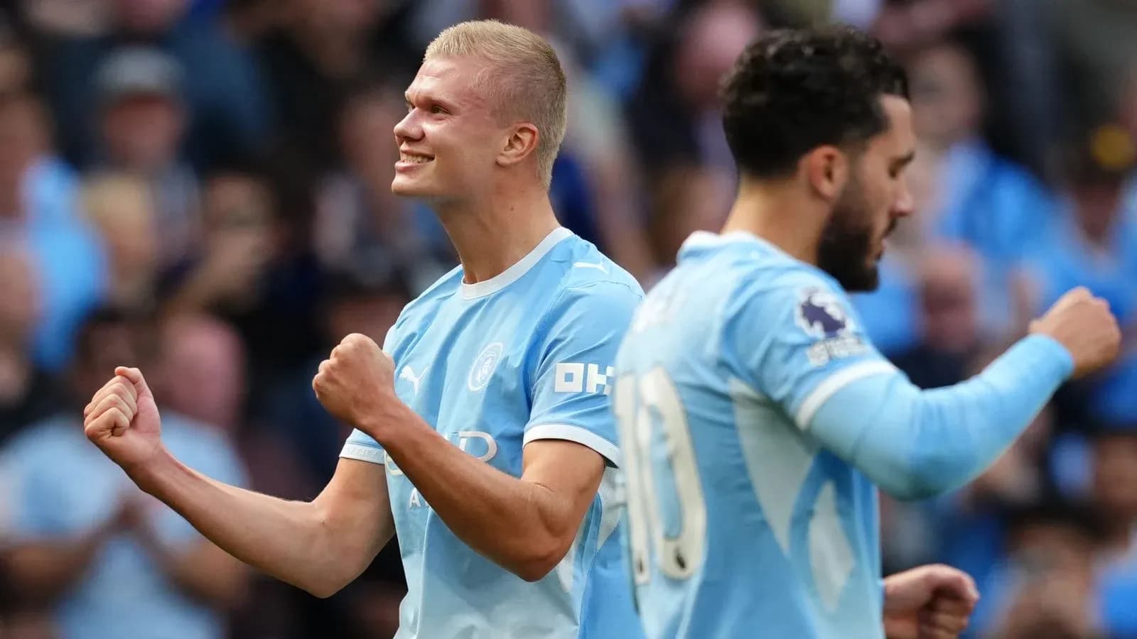 Erling Haaland celebrating a goal with teammates