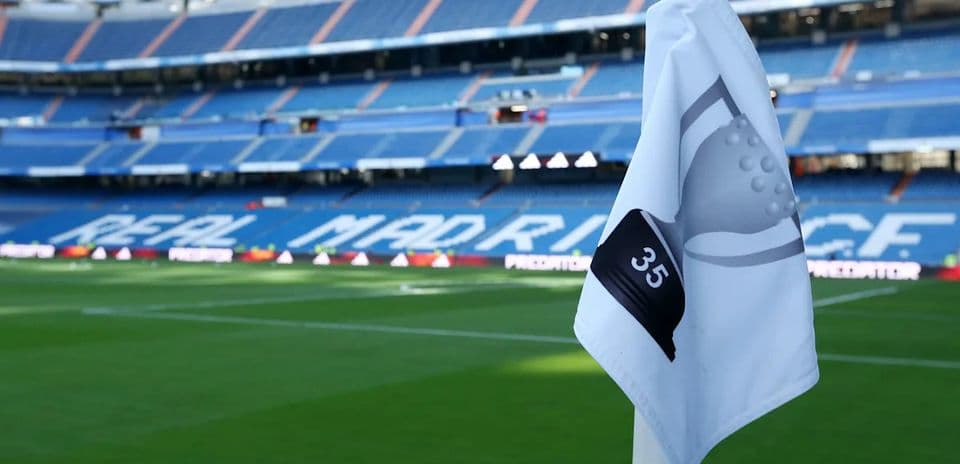 Real Madrid stadium corner flag with seating in background