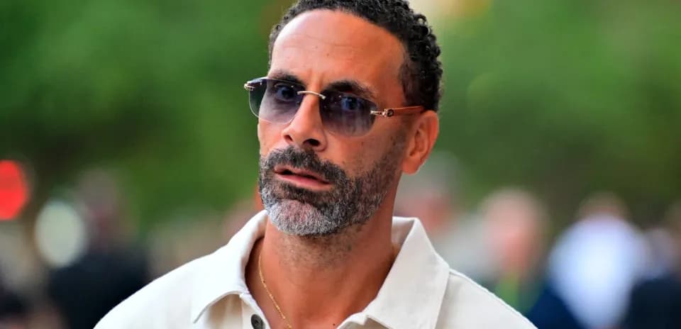 Man with sunglasses walking in urban setting