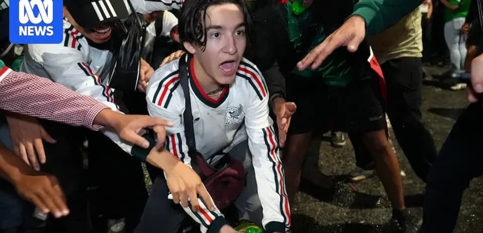 Fans celebrating with drinks during an event