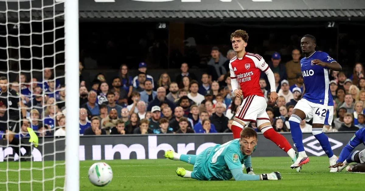 Arsenal player celebrating after scoring against Everton
