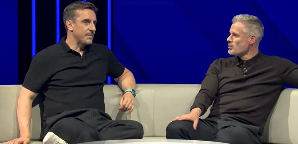 Two sports analysts discussing on a sofa