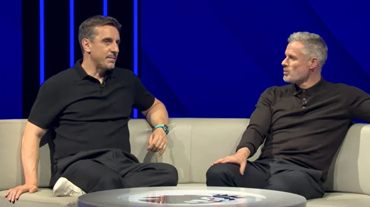 Two sports analysts discussing on a sofa