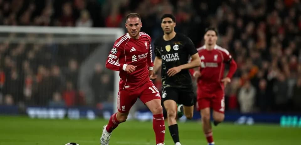 Liverpool player running with ball during match