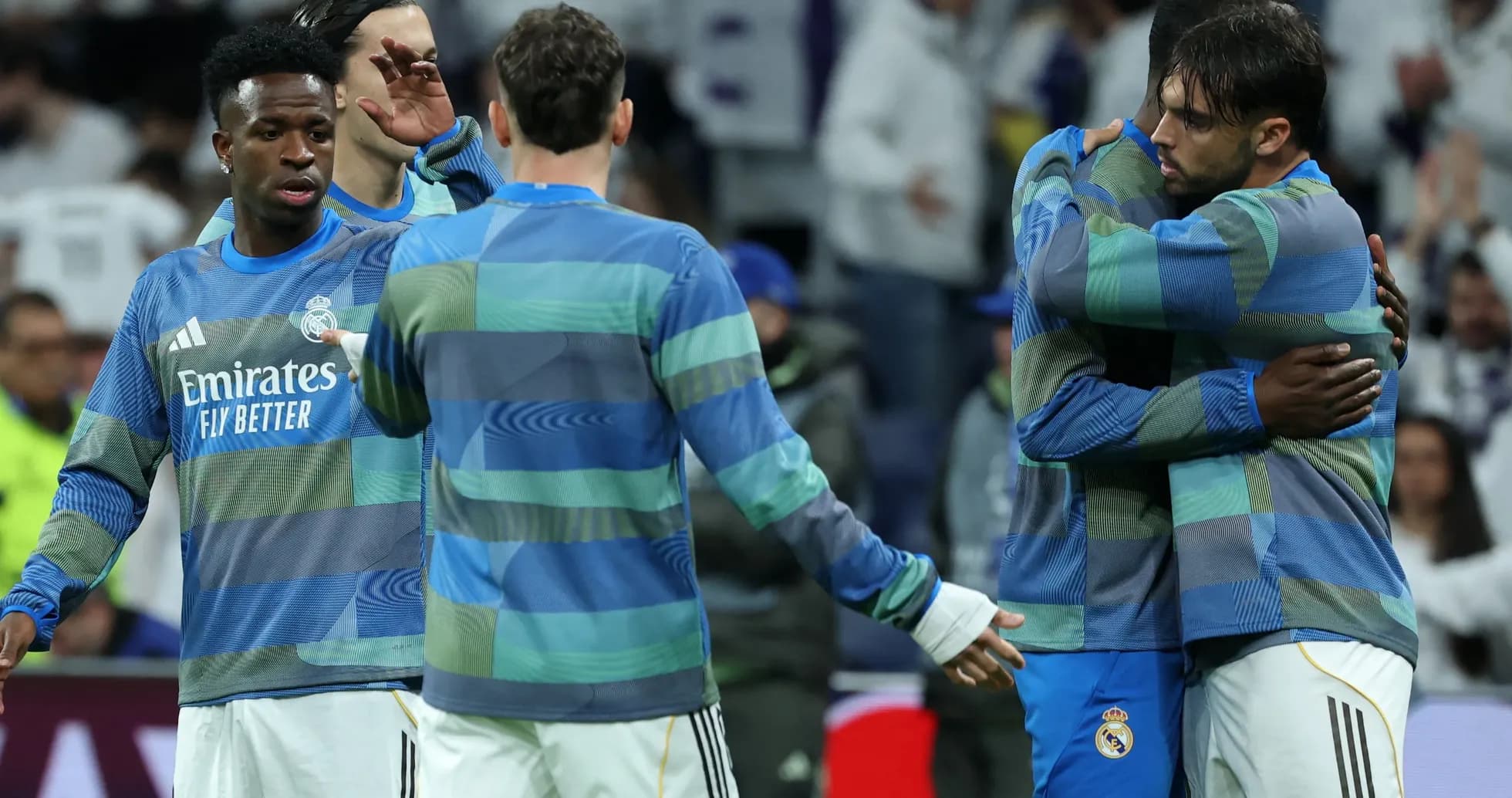 Real Madrid players hugging during warm-up session