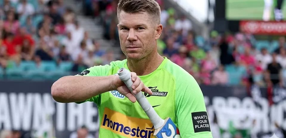 Cricketer preparing for batting with his bat