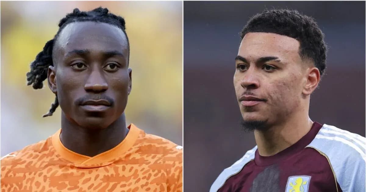Two football players posing for the camera