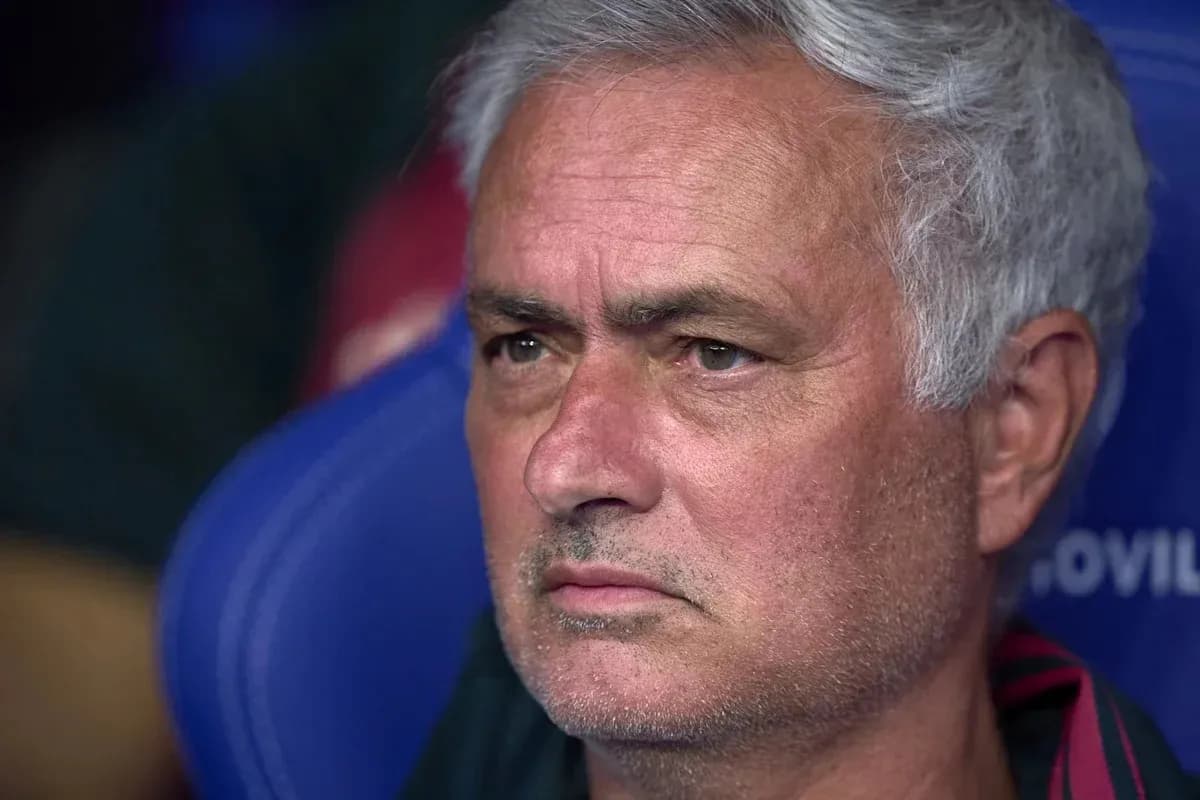 Coach observing match from the bench
