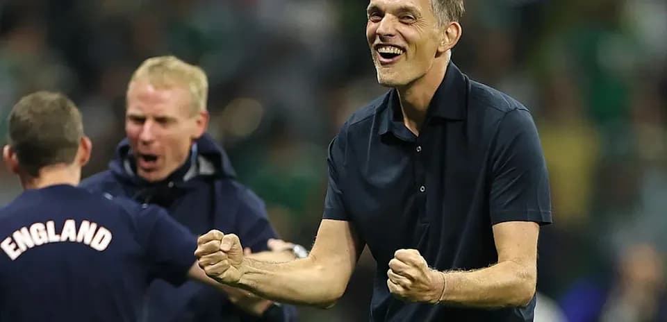 Coach celebrating with staff after a match