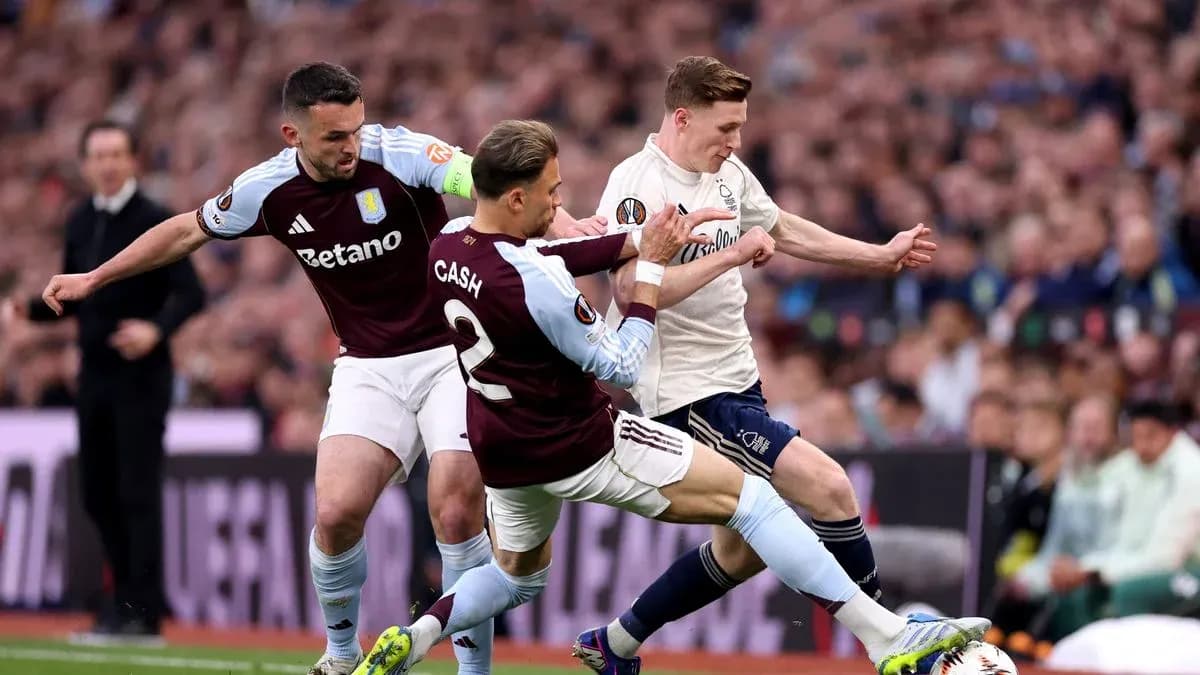 Aston Villa players challenging opponent for the ball