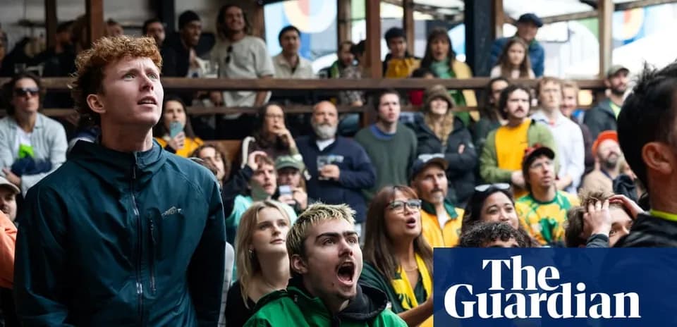 Fans watching a sports event, displaying excitement