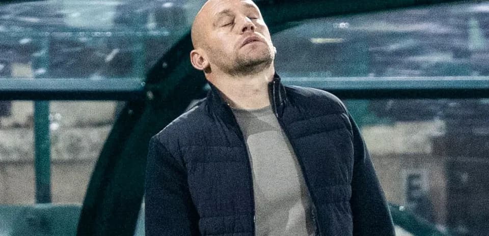 Coach observing the game from the sidelines