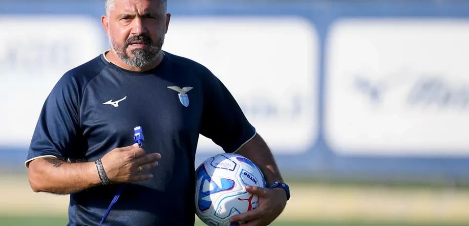 Lazio coach holding a ball during training session
