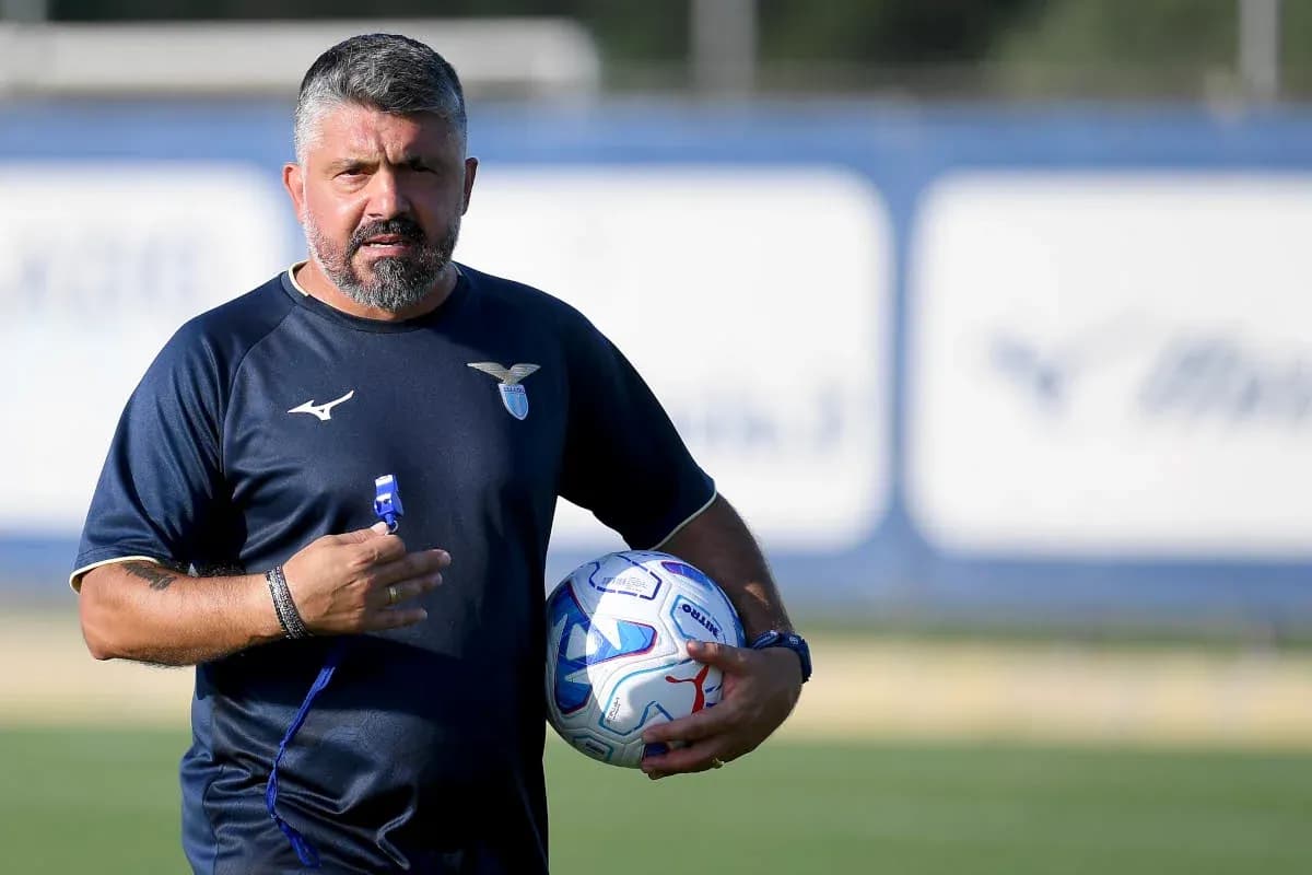 Lazio coach holding a ball during training session