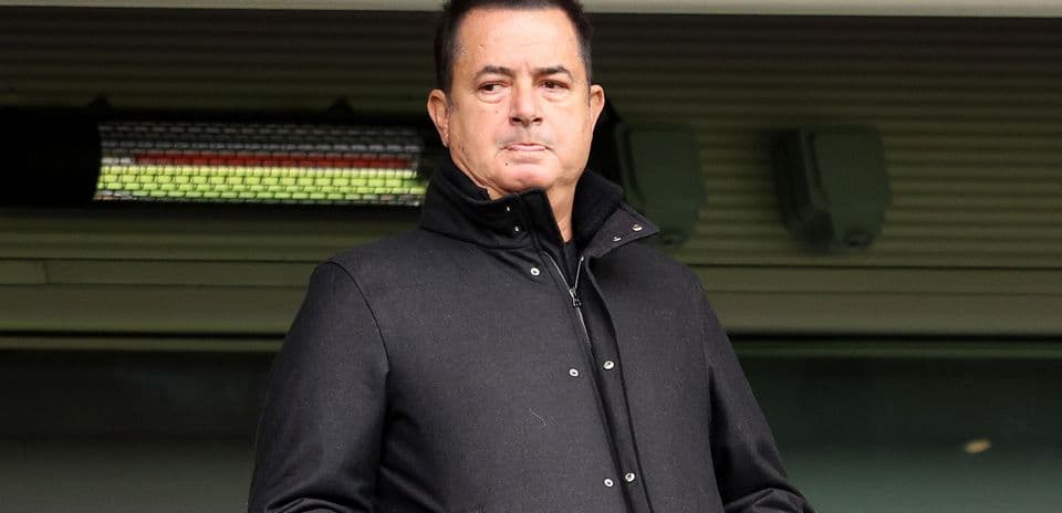 Person in black coat at sporting venue